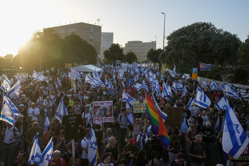 People take part in a protest against Israeli Prime Minister Benjamin Netanyahu’s government, demanding new elections and the release of the hostages held in the Gaza Strip (Ohad Zwigenberg/AP)