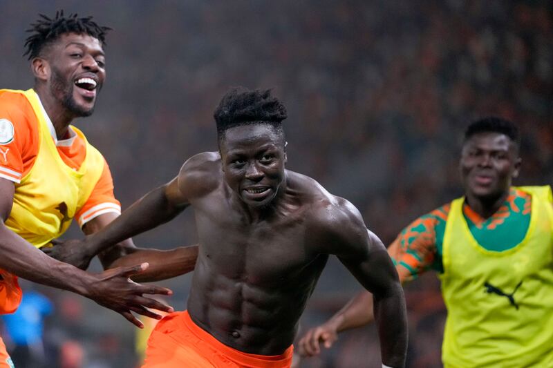 Ivory Coast ‘s Oumar Diakite (centre) celebrates with team-mates after his last-gasp winner over Mali (Sunday Alamba/AP)