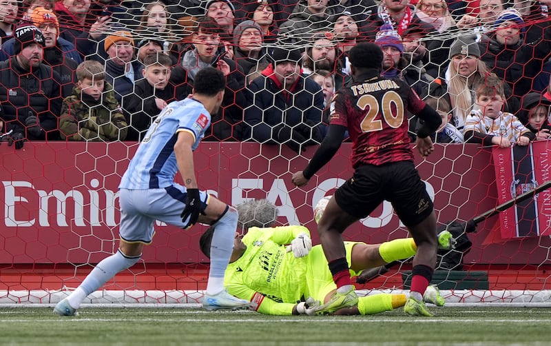 Tamworth’s Nathan Tshikuna (right) scored an own goal against Tottenham