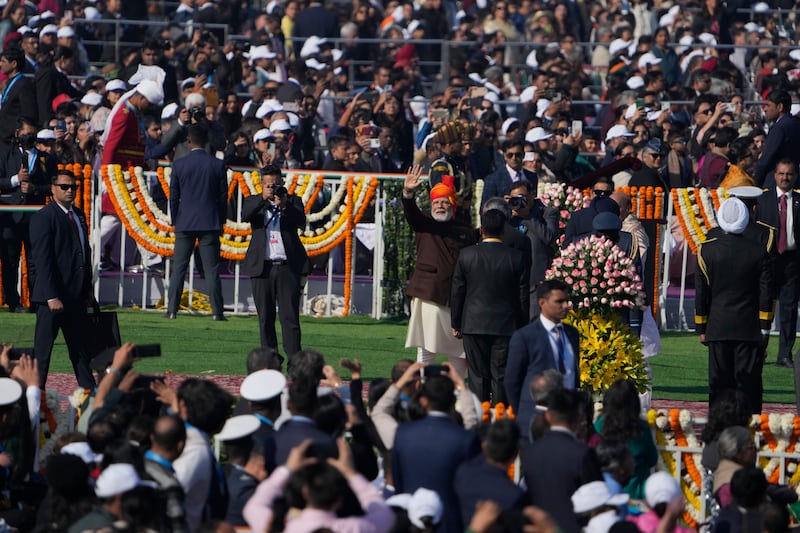 Indian Prime Minister Narendra Modi waves as he arrives for the parade (Channi Anand/AP)