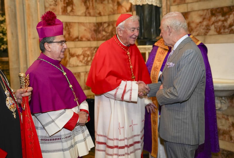 Charles is greeted by cardinal Vincent Nicholls as he arrives for the service