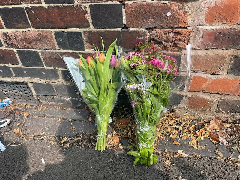 Flowers left at the scene on Flax Street