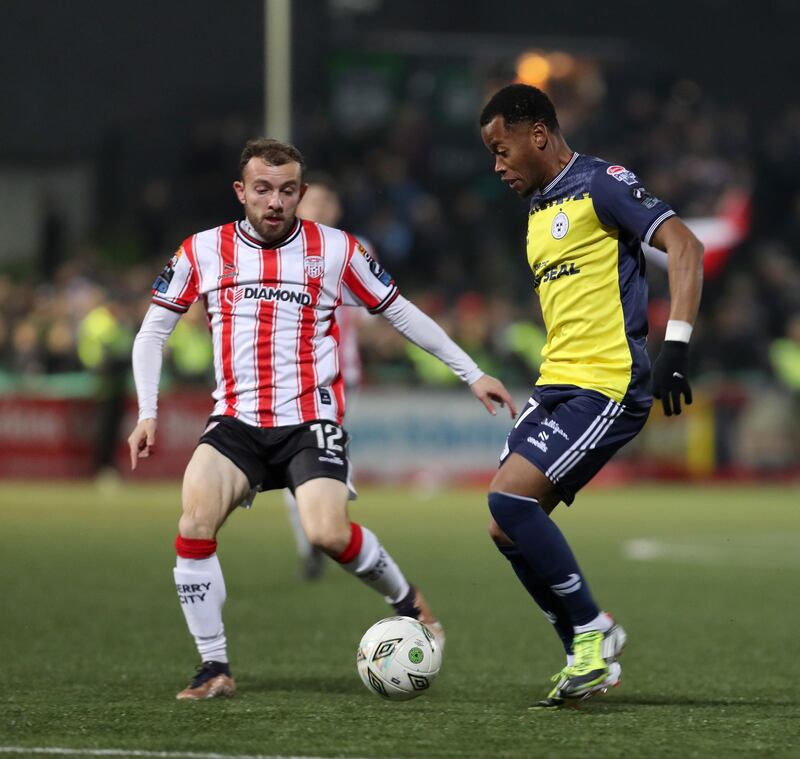 Derry City Paul McMullan with Rayhaan Tulloch of Shelbourne during Friday nights match at the Brandywell