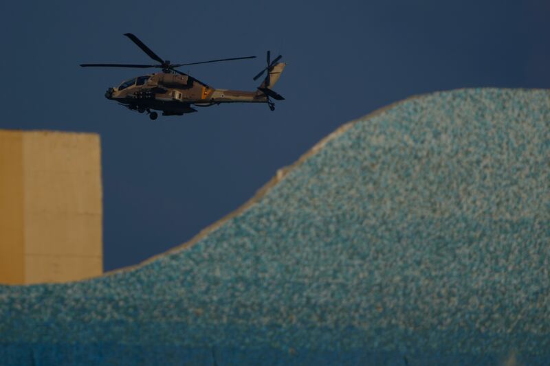 An Israeli Apache helicopter flies over Israel (Ariel Schalit/AP)