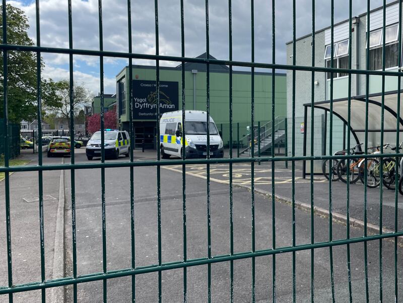 Police vehicles at the scene of the incident