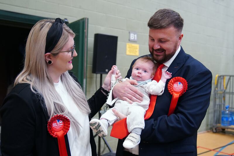 Labour candidate Chris Webb celebrates with his wife Portia and baby after winning the Blackpool South by-election