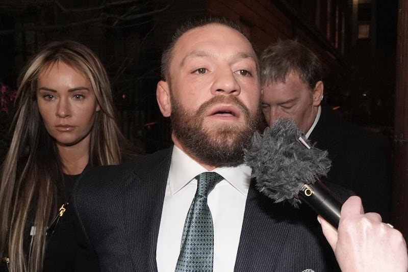 Mixed martial arts fighter Conor McGregor and his partner Dee Devlin leave the High Court in Dublin