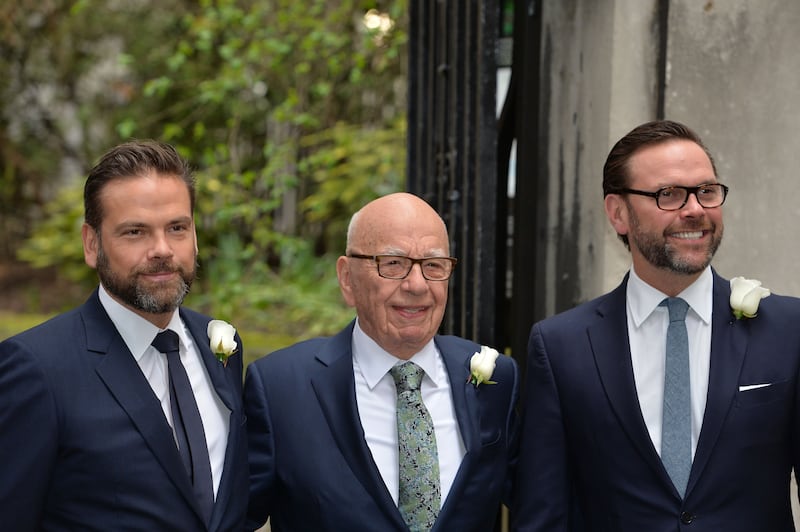 Rupert Murdoch accompanied by his sons James (right) and Lachlan (left)