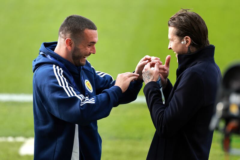 Scotland’s John McGinn greets team-mate Dykes