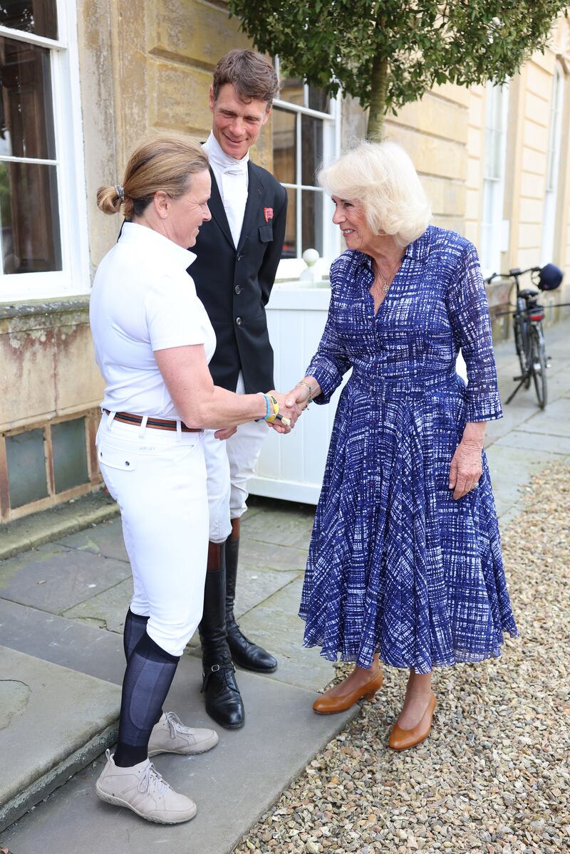 Camilla is greeted by previous winners Pippa Funnell and William Fox-Pitt