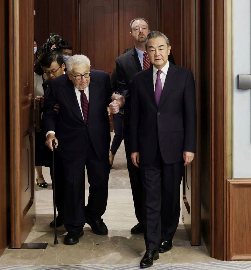 Former secretary of state Henry Kissinger, left, meets with Chinese state councillor Wang Yi in Beijing 