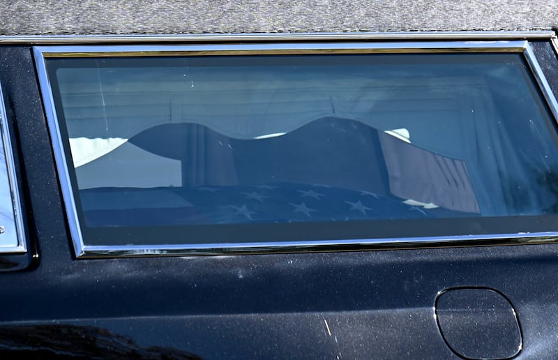 The hearse with the coffin of Jimmy Carter arrives at the Jimmy Carter Boyhood Farm (Hyosub Shin/Atlanta Journal-Constitution/AP)