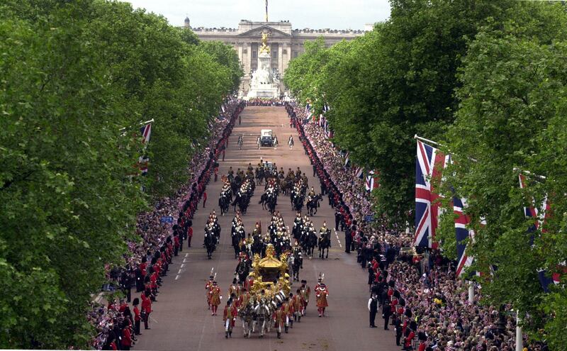 The gold state coach carrying Queen Elizabeth II during the Golden Jubilee celebrations in The Mall