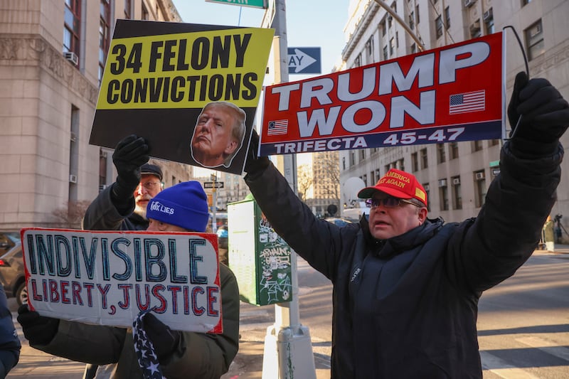 Demonstrators outside court before sentencing in Donald Trump’s hush money case (Yuki Iwamura/AP)