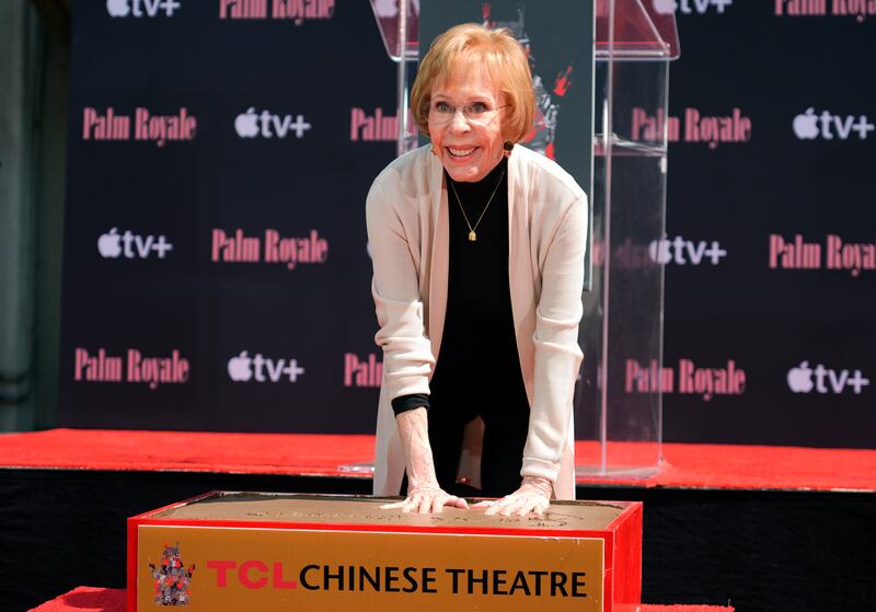 Comedian Carol Burnett puts her hands in cement during a ceremony for her at the TCL Chinese Theatre (Chris Pizzello/AP)