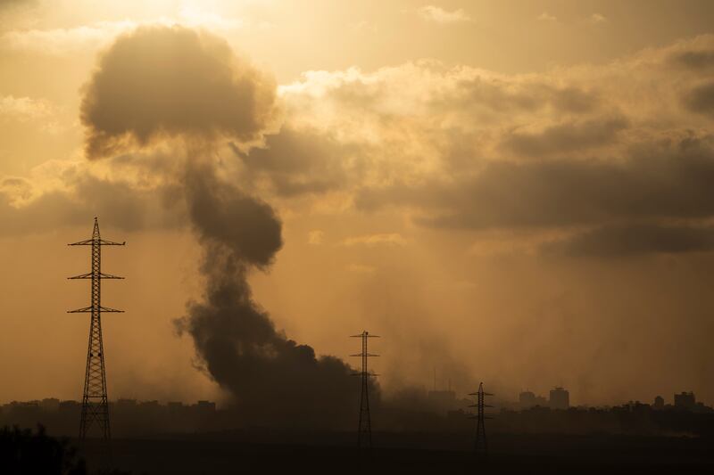 Smoke rises after an explosion in the Gaza Strip as seen from southern Israel (Leo Correa/AP)