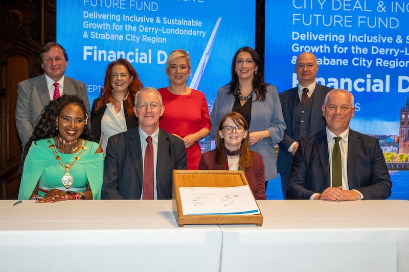 Pictured back row, left to right: Leo Murphy, chief executive North West Regional College, Eimear McCauley, executive director of finance, contracts and capital development at Western Health & Social Care Trust, First Minister Michelle O'Neill, Deputy First Minister Emma Little-Pengelly, and Paul Bartholomew from Ulster University; and front row, left to right, Mayor of Derry City and Strabane District Council Lilian Seenoi-Barr, secretary of state Hilary Benn, finance minister Caoimhe Archibald and John Kelpie, chief executive of Derry City and Strabane District Council, at the signing of the the Derry City and Strabane growth deal on Wednesday