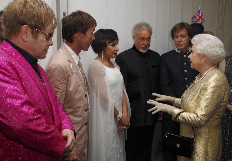 The late Queen Elizabeth II with (left to right) Sir Elton John, Sir Cliff Richard, Dame Shirley Bassey, Sir Tom Jones and Sir Paul McCartney