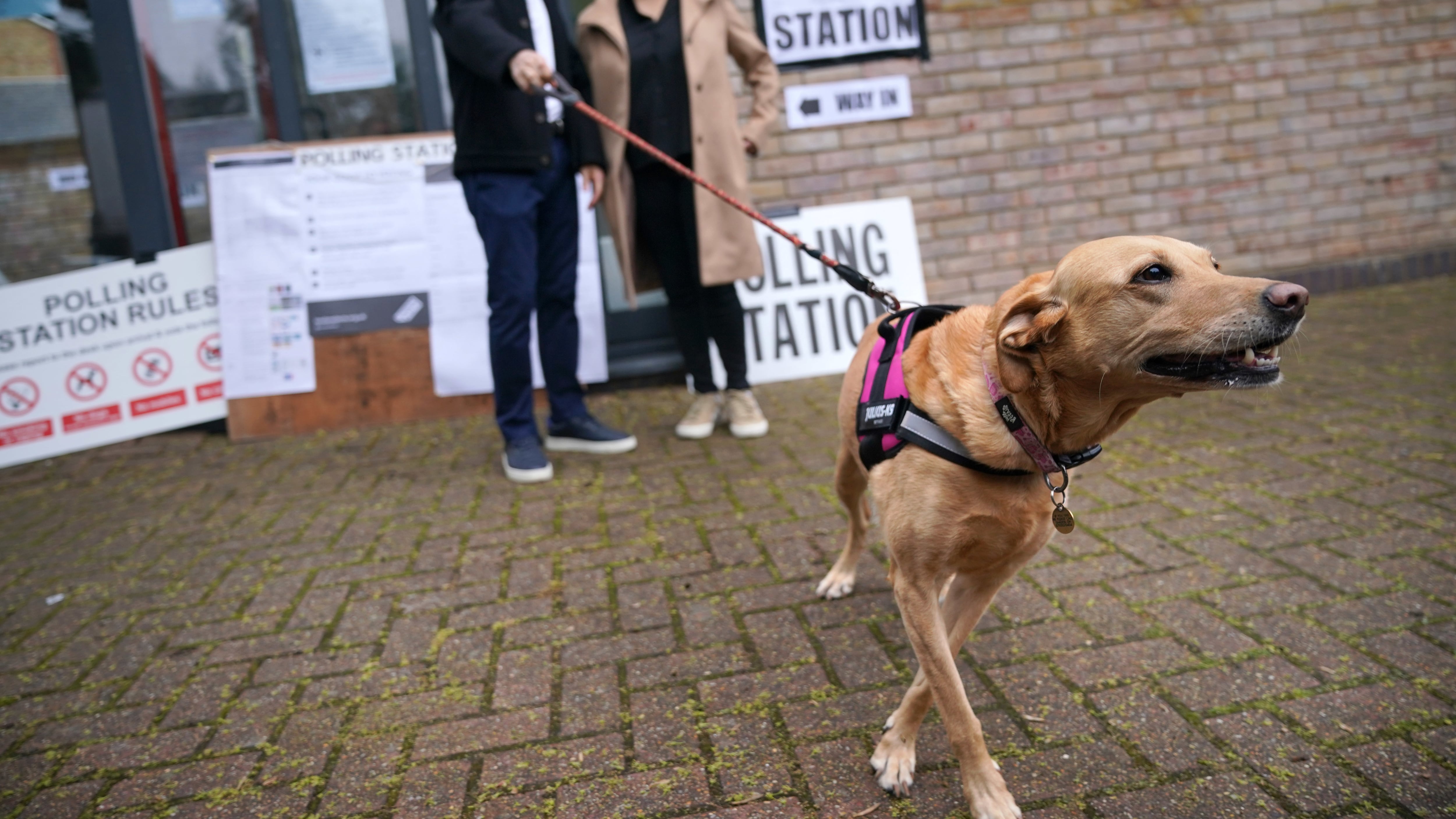 Sadiq Khan with his wife Saadiya Khan and dog Luna visited a polling station in south London