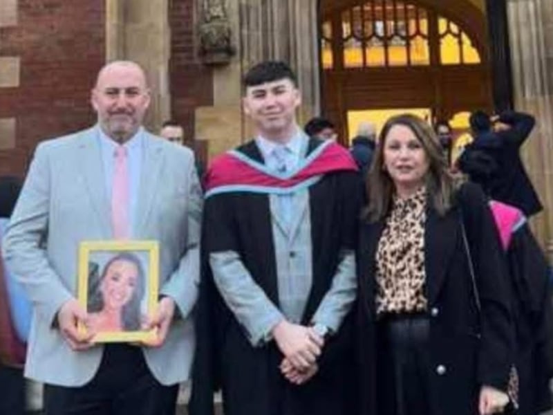 Chloe's parents Declan and Sharon hold a picture of their daughter at her brother Christopher's QUB graduation ceremony.