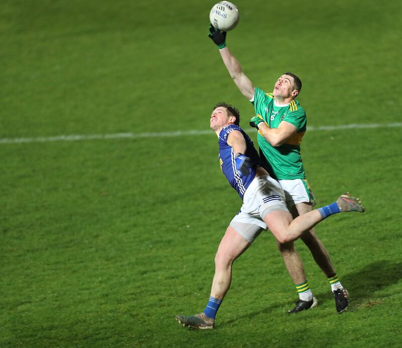 Ciaran McFaul gets to the ball ahead of Darren Hughes near the end of Sunday's enthralling Ulster Club final. Picture: Margaret McLaughlin