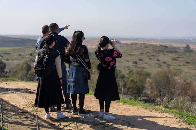 People look at the Gaza Strip from an observation point in Sderot, southern Israel (Ariel Schalit/AP)