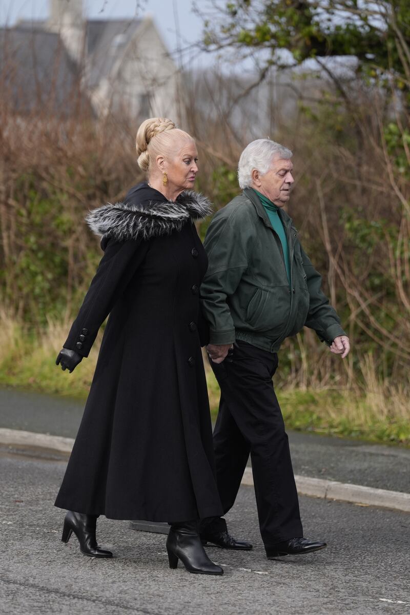 Kim Woodburn arrives for the funeral