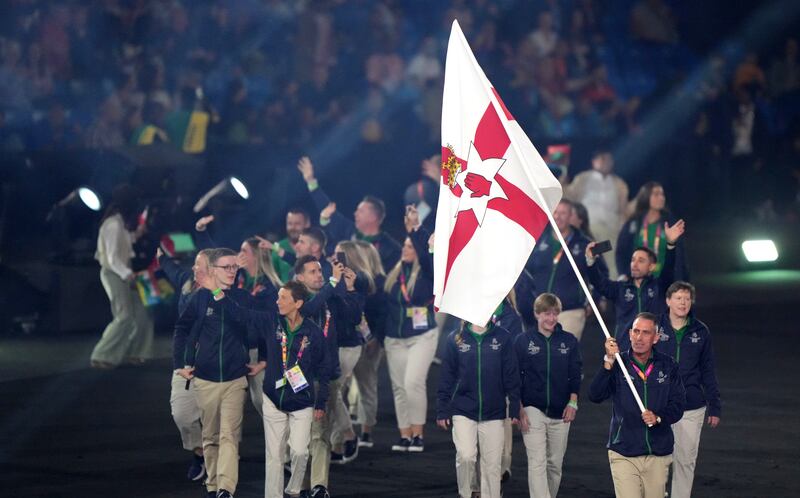 The Northern Ireland flag is carried into Birmingham's Alexander Stadium at the opening ceremony of the last Commonwealth Games. Picture by PA