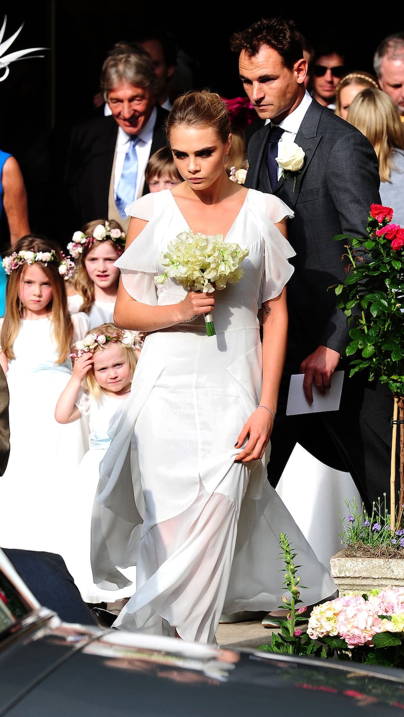 Cara Delevingne at the wedding of her sister Poppy Delevingne and James Cook at St Paul’s Church in Kensington