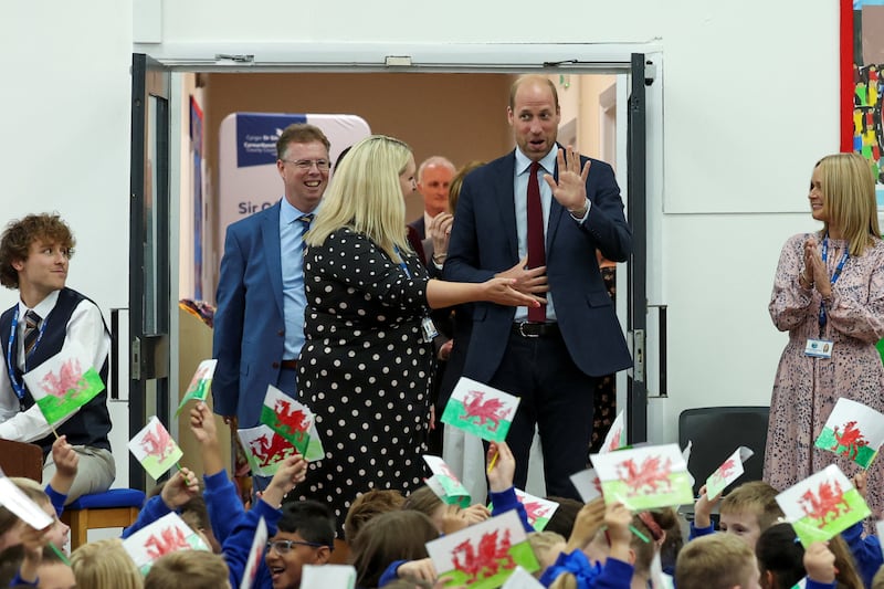 William is welcomed to the school by cheering pupils