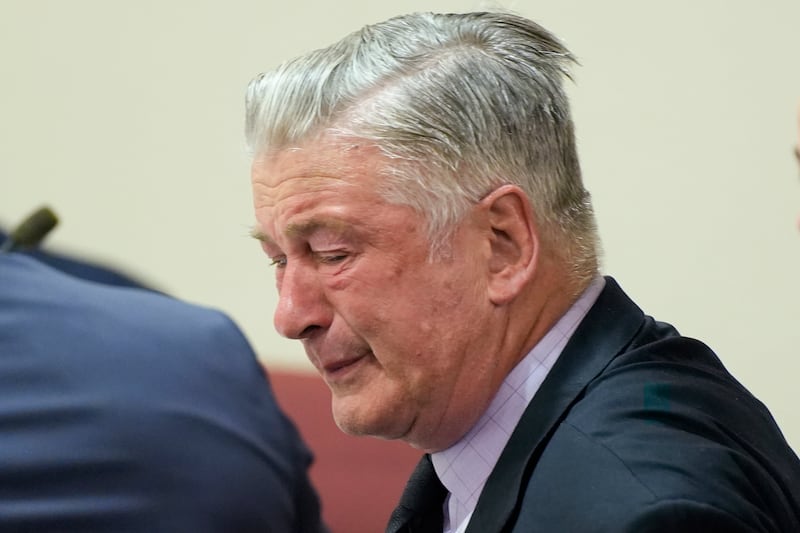 Actor Alec Baldwin reacts after a judge threw out the involuntary manslaughter case for the 2021 fatal shooting of cinematographer Halyna Hutchins during filming of the Western movie Rust (Ramsay de Give/Pool Photo via AP)