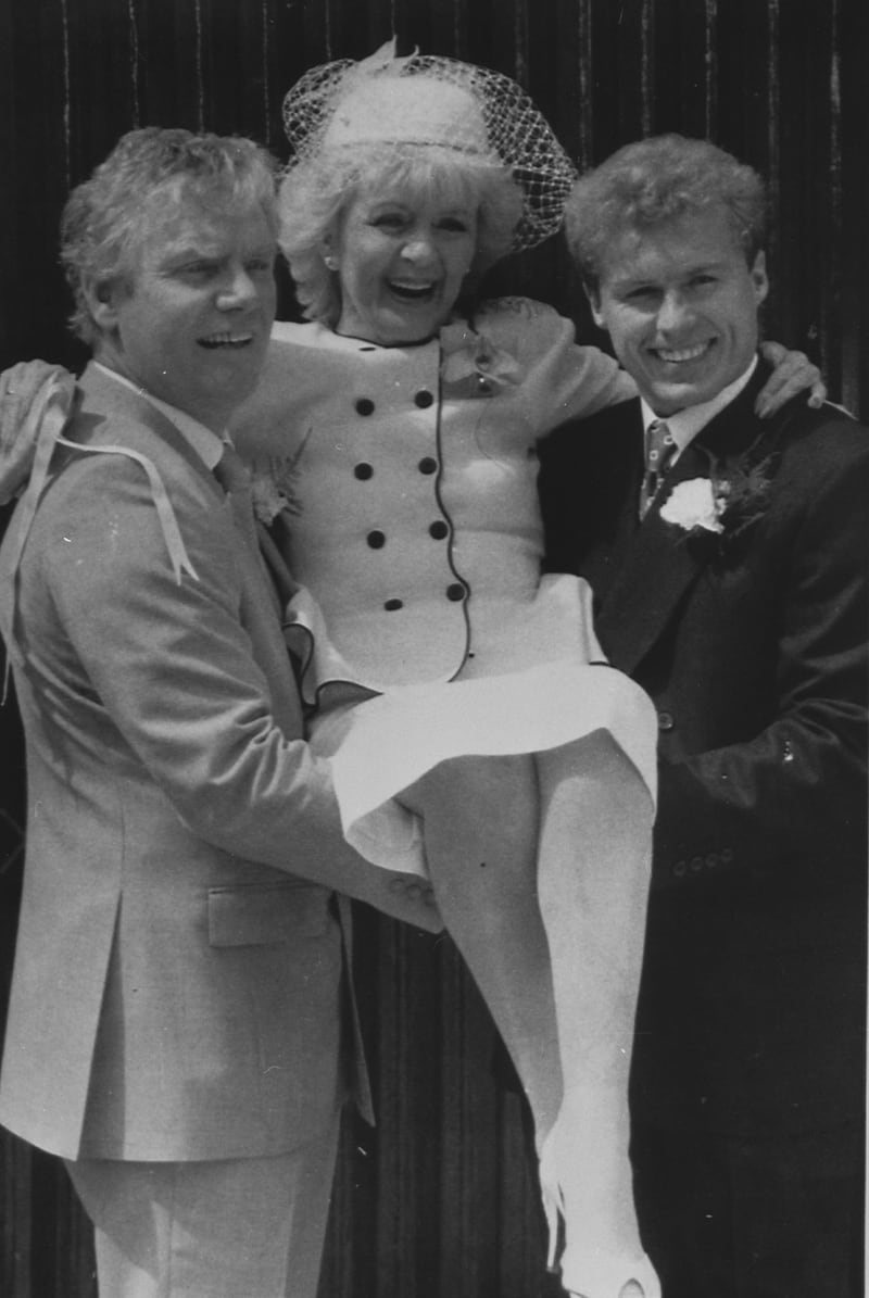 Coronation Street bride Ivy Tilsley is given a lift by her on-screen groom, Don Brennan, left, and on-screen son Brian