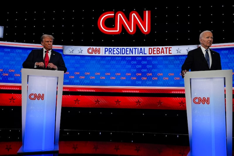 President Joe Biden and Donald Trump, left, stand during break in the presidential debate on June 27 in which Mr Biden delivered a halting performance (John Bazemore/AP)