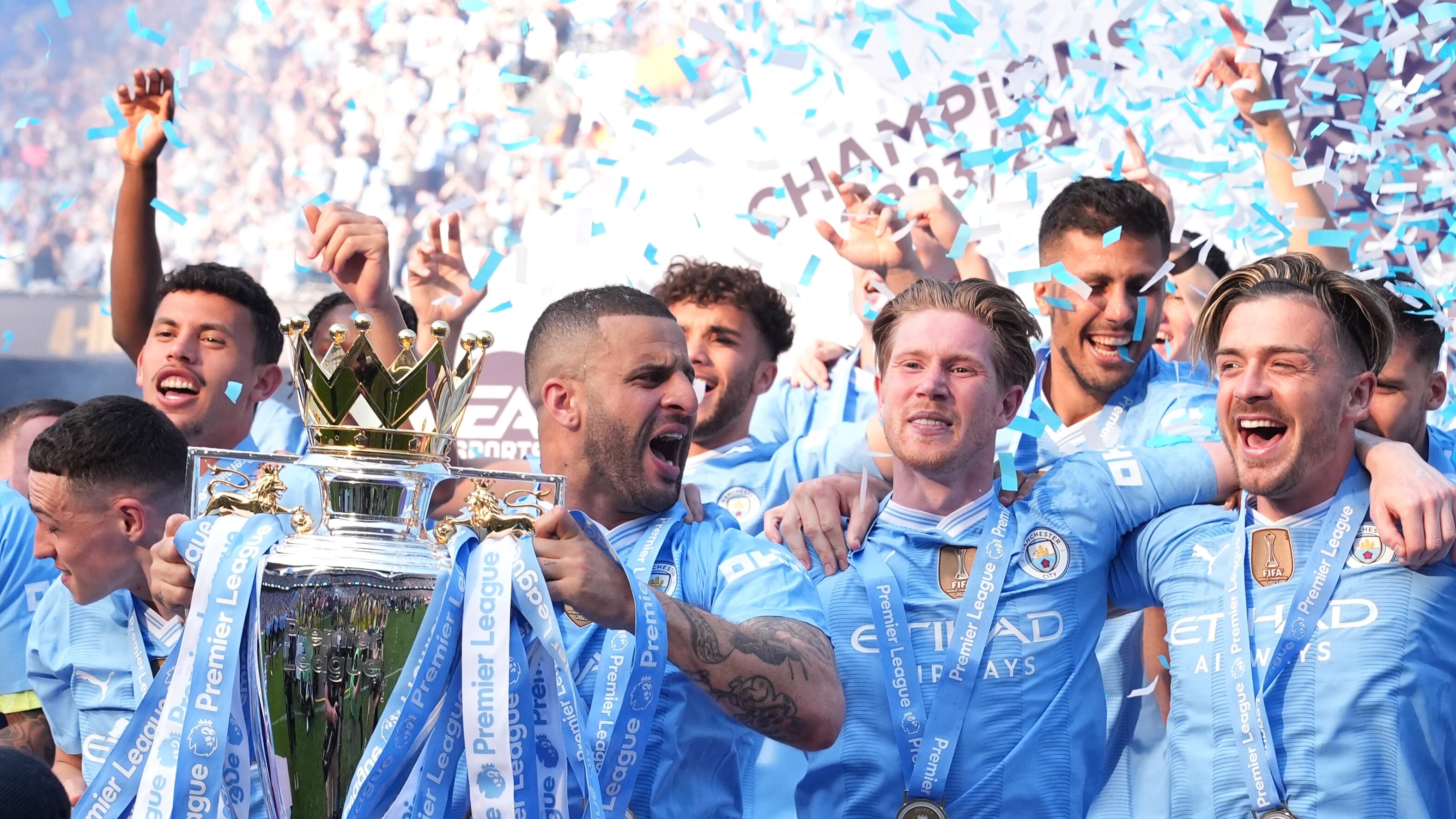 Manchester City’s Kyle Walker lifts the Premier League trophy