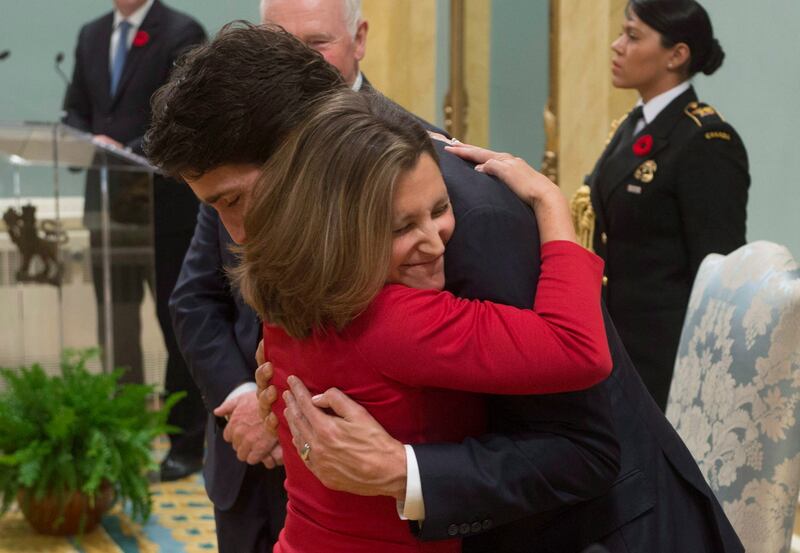 Chrystia Freeland gives Prime Minister Justin Trudeau a hug after being sworn in during ceremonies at Rideau Hall (Adrian Wyld/The Canadian Press via AP)