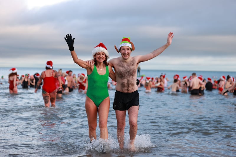 The Alliance Party’s Gillian McCollum and minister of agriculture, environment and rural affairs Andrew Muir take part in the annual Christmas Eve swim at Helen’s Bay