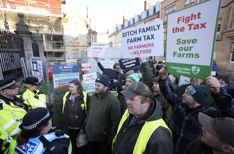 Farmers make their point outside the Oxford Farming Conference at The Examination Schools, Oxford