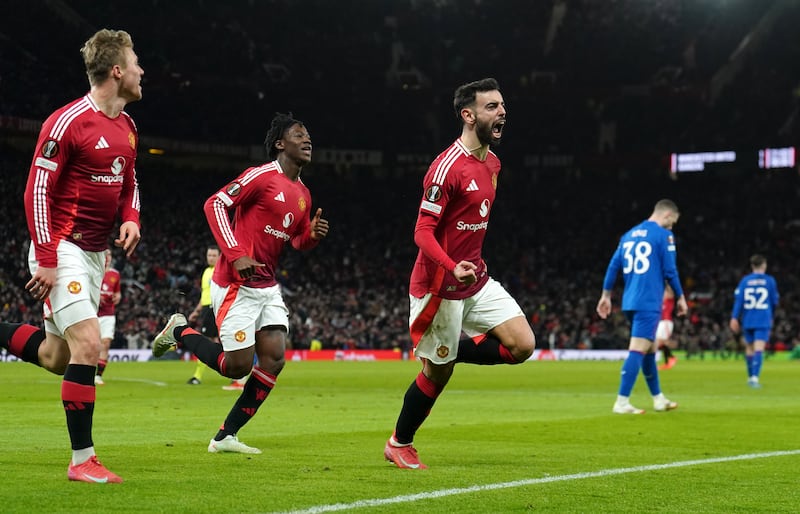 Bruno Fernandes (right) struck in stoppahe time to give Manchester United victory over Rangers at Old Trafford