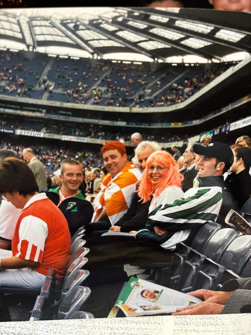 Donna Curran, her father Peter Donnelly and her husband Toby Curran. The man smiling across from them is Shay Kelly.