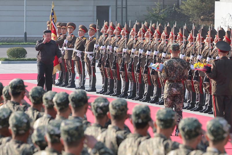 In this photo provided by the North Korean government, North Korean leader Kim Jong Un, left on the red carpet, visits the headquarters of the North Korean People’s Army’s 2nd Corp (Korean Central News Agency/Korea News Service/AP)