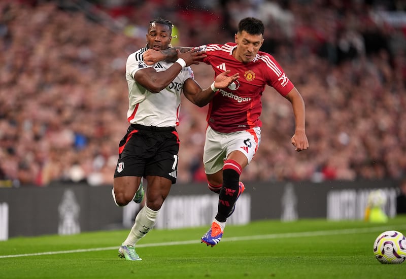 Fulham’s Adama Traore attempts to get past Manchester United’s Lisandro Martinez