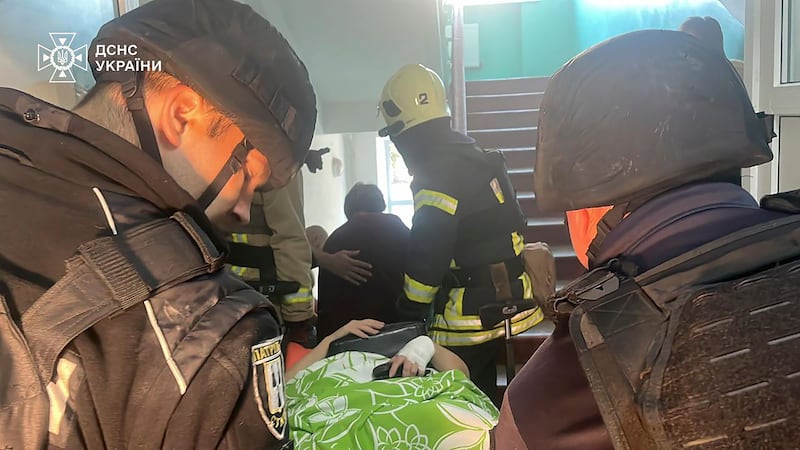 Emergency services workers evacuate patients (Ukrainian Emergency Service via AP)