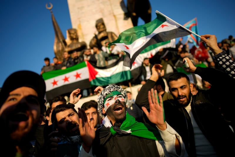 People gather to celebrate the Syrian government’s fall, in Istanbul, Turkey (Emrah Gurel/AP)