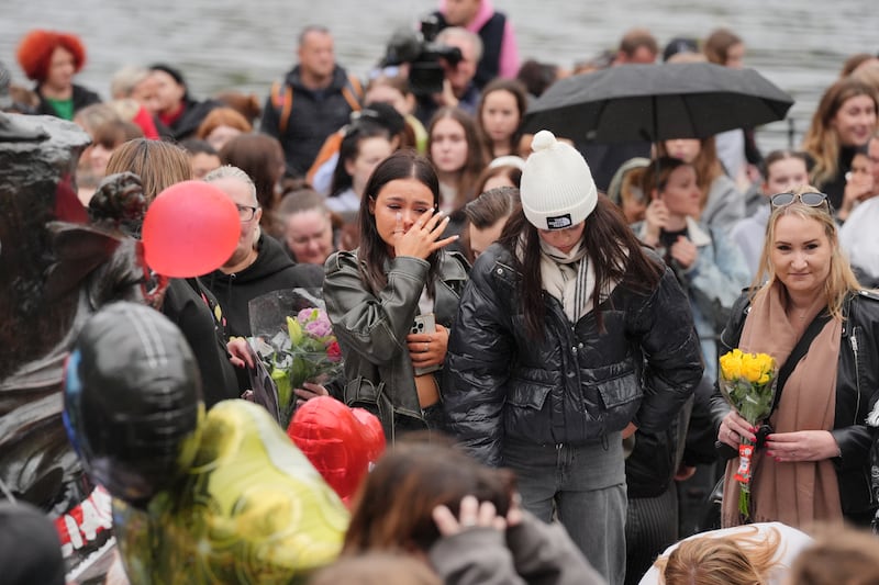 People attend a vigil for 31-year-old One Direction singer Liam Payne