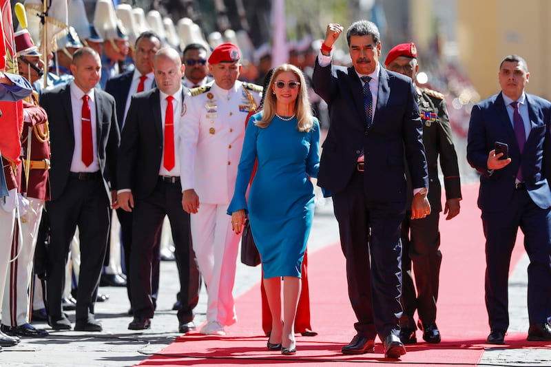 Venezuelan President Nicolas Maduro and his wife Cilia Flores arrive at the National Assembly for his swearing-in ceremony (Cristian Hernandez/AP)