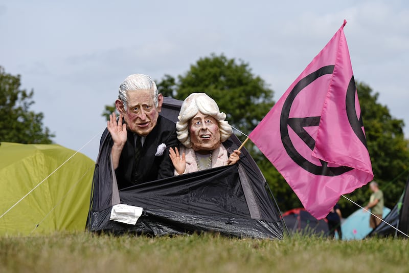 Demonstrators wearing masks in a tent at the Extinction Rebellion ‘upgrade democracy’ mass occupation