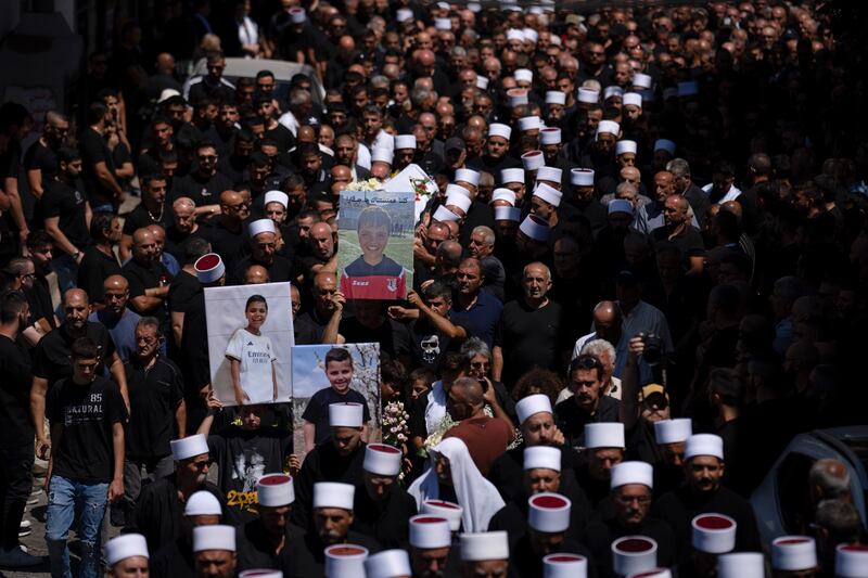 Mourners from the Druze minority attend the funeral for Guevara Ibrahim (Leo Correa/AP)