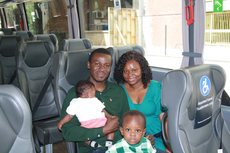 Family of four sat on a coach