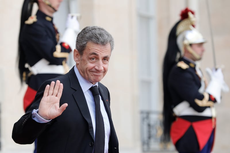 Nicolas Sarkozy leaves the Elysee Palace after a lunch with heads of states and officials (AP/Kamil Zihnioglu)