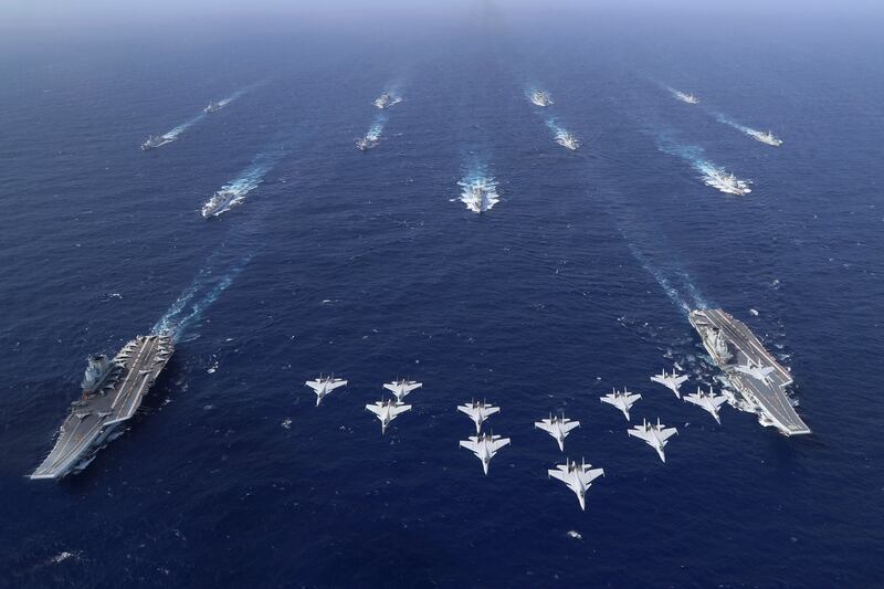 Conventionally powered Chinese aircraft carriers Liaoning and Shandong carry out a dual aircraft carrier formation exercise for the first time in the South China Sea (Chen Mengxi/Xinhua via AP)